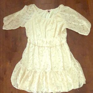 Beautiful cream lace dress with cinched waist.
